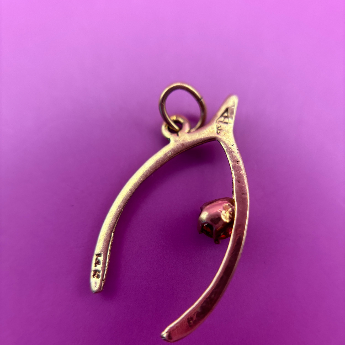 14k wishbone with garnet charm