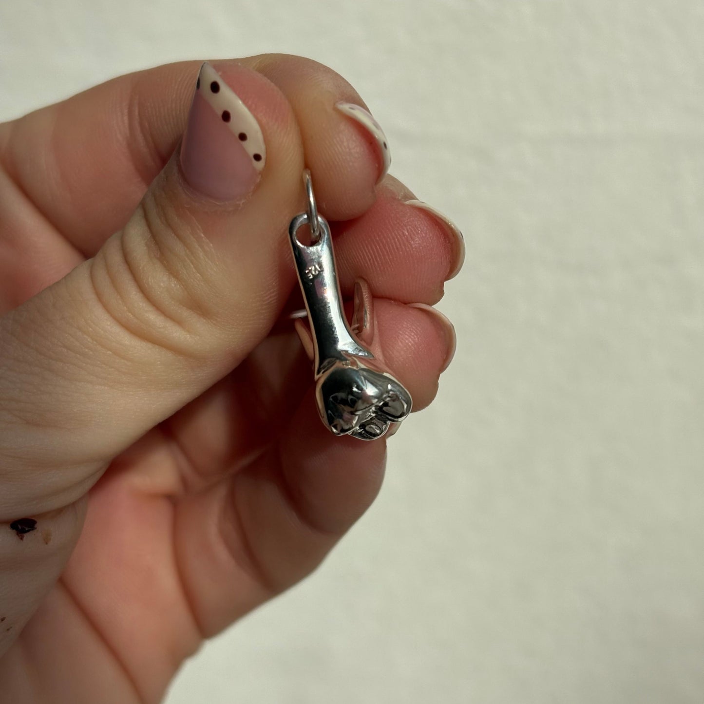 silver tooth pendant