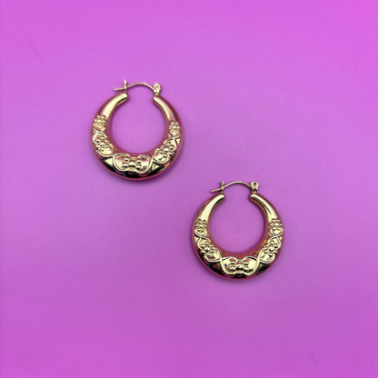 14k hollow hoops with floral pattern