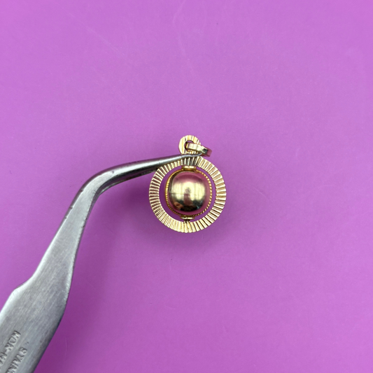 14k spinning orb engine turned charm