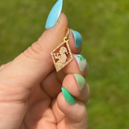 18k meso woman with flute charm