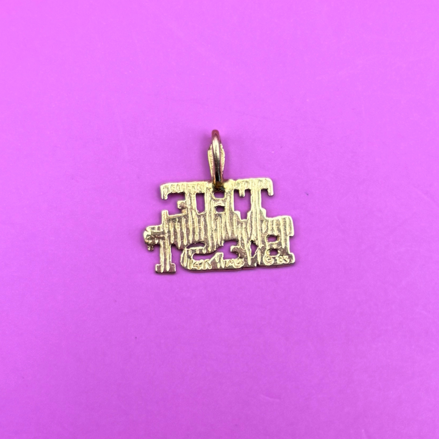 14k ‘the best’ charm by Michael Anthony