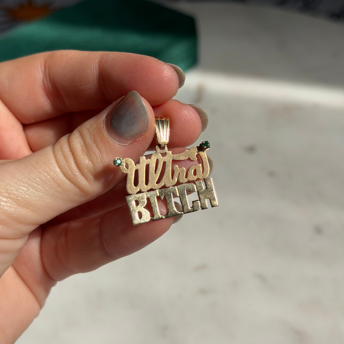 14k ultra bitch with emeralds charm