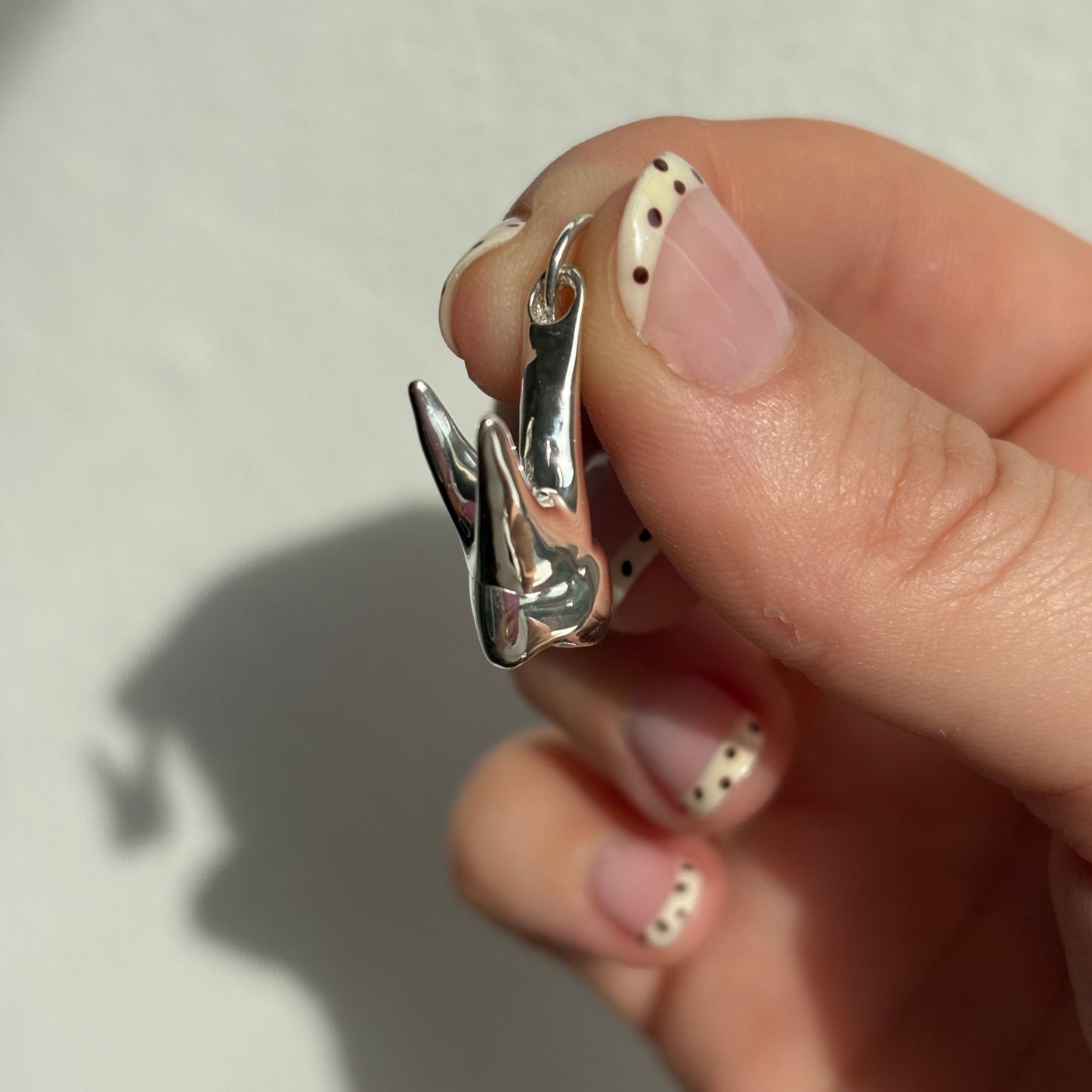 silver tooth pendant