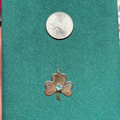 14k engine turned 3 leaf clover with blue topaz charm