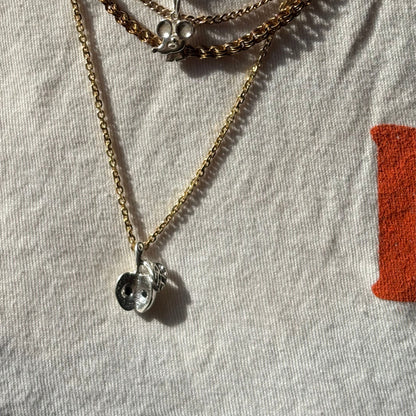 silver big apple with black diamond seeds charm