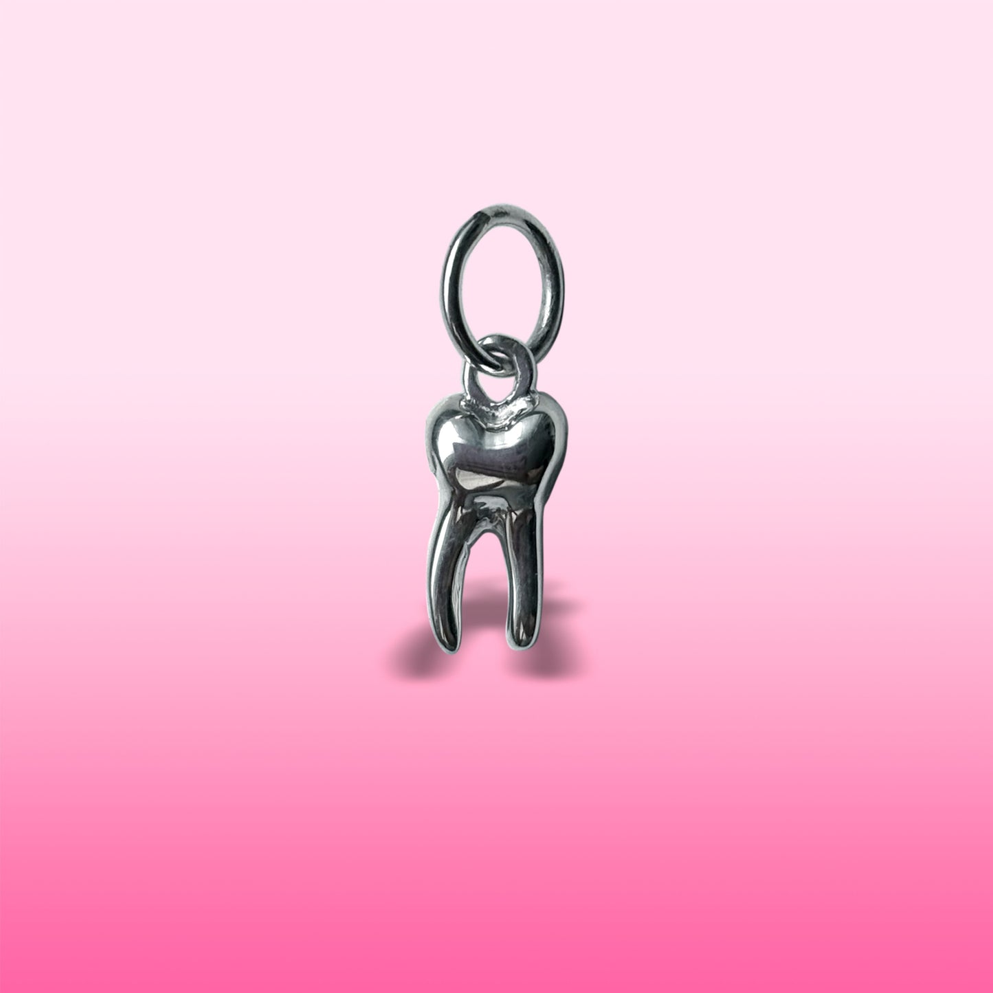 silver baby tooth charm