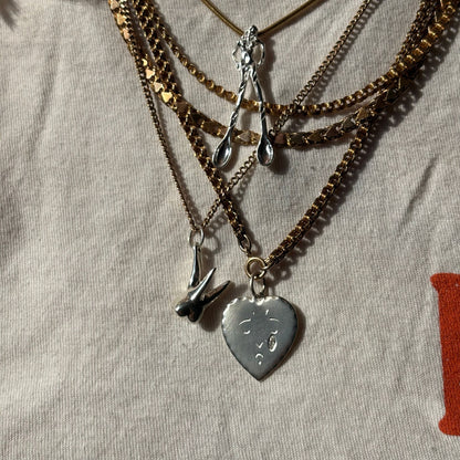 silver tooth pendant