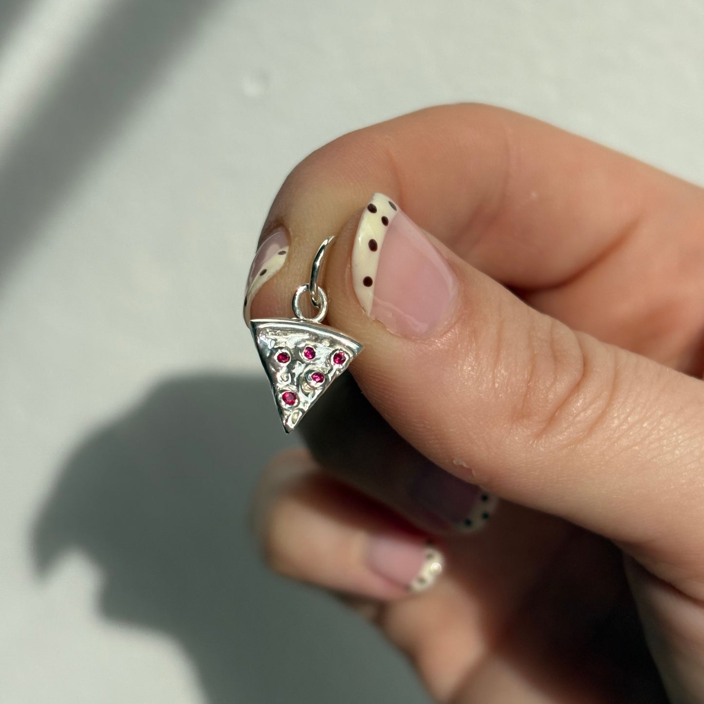 silver pizza with ruby pepperonis charm