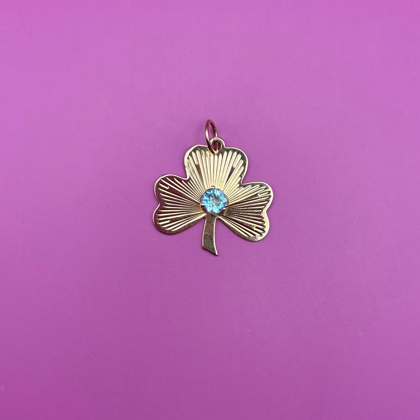 14k engine turned 3 leaf clover with blue topaz charm