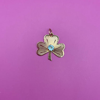 14k engine turned 3 leaf clover with blue topaz charm