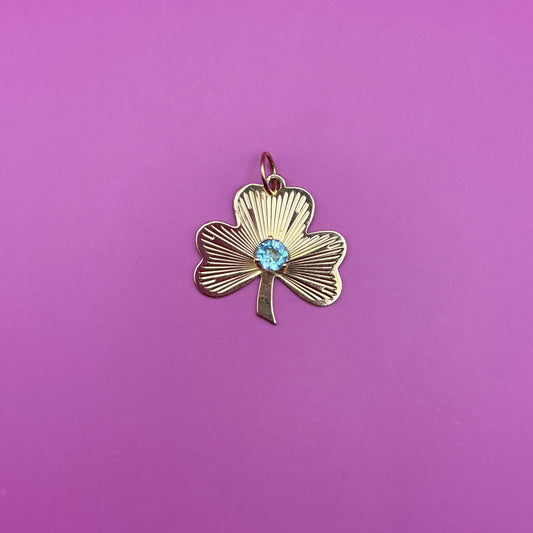 14k engine turned 3 leaf clover with blue topaz charm