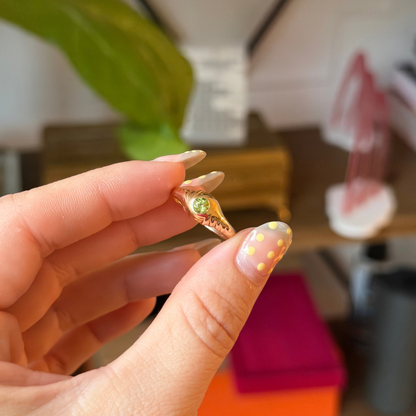 14k eye of the storm ring with peridot