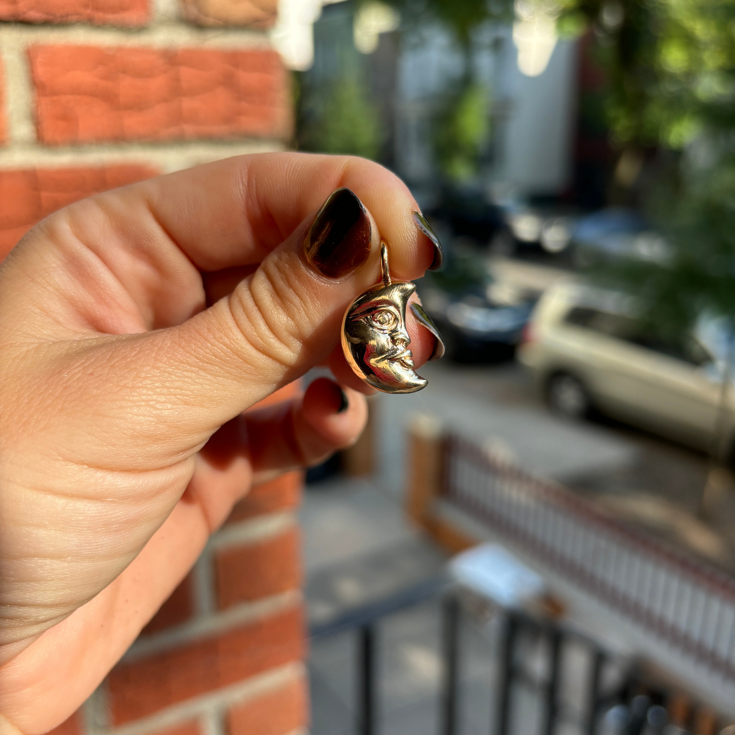 the moon face charm