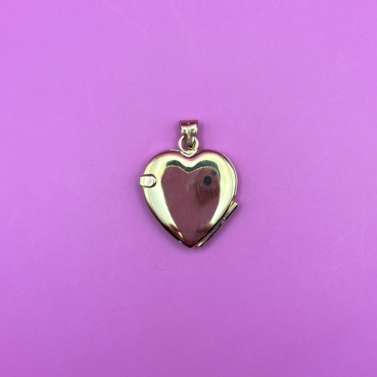 14k heart locket with flower and leaf motif engraving