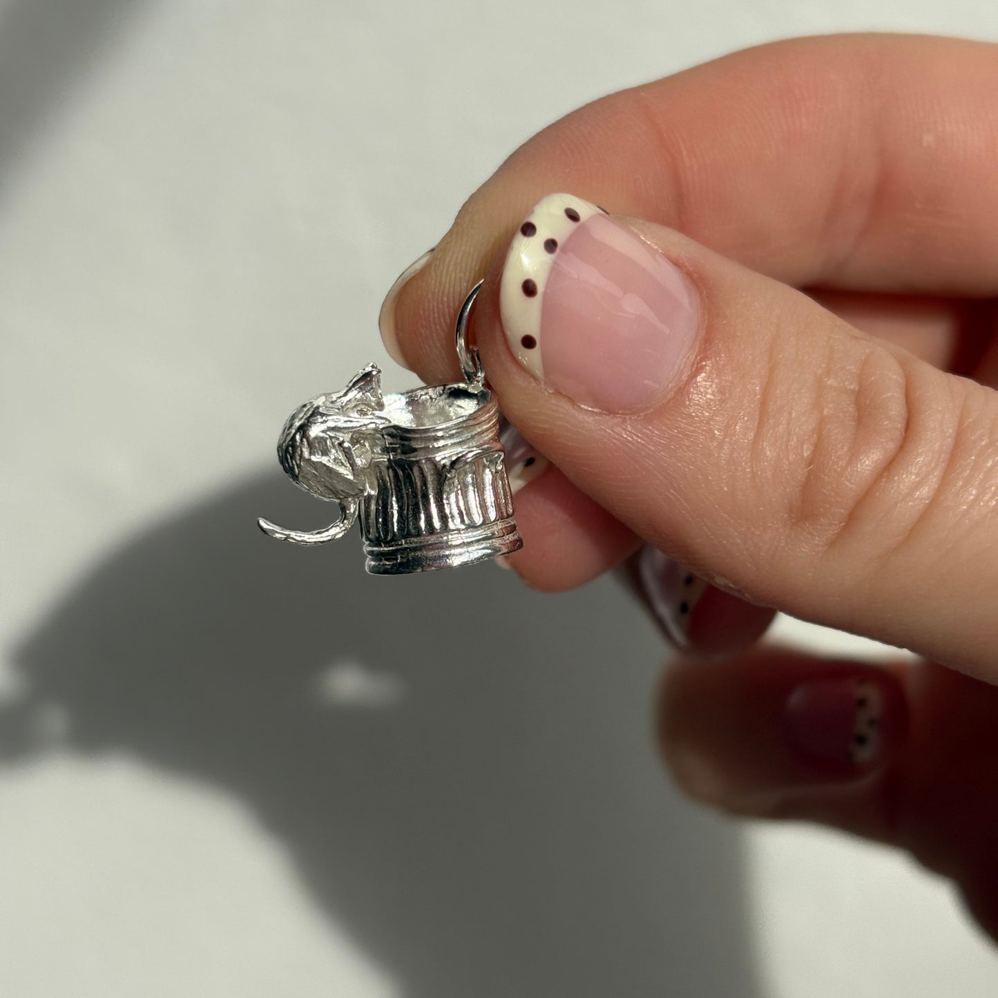 silver trash cat charm