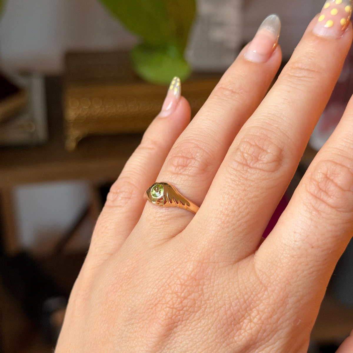 14k eye of the storm ring with peridot