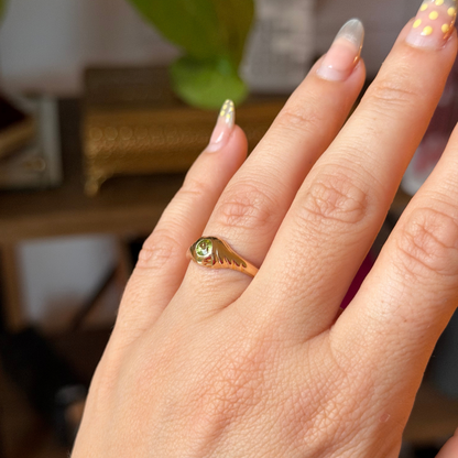 14k eye of the storm ring with peridot