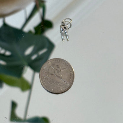 silver baby tooth with star set black diamond charm