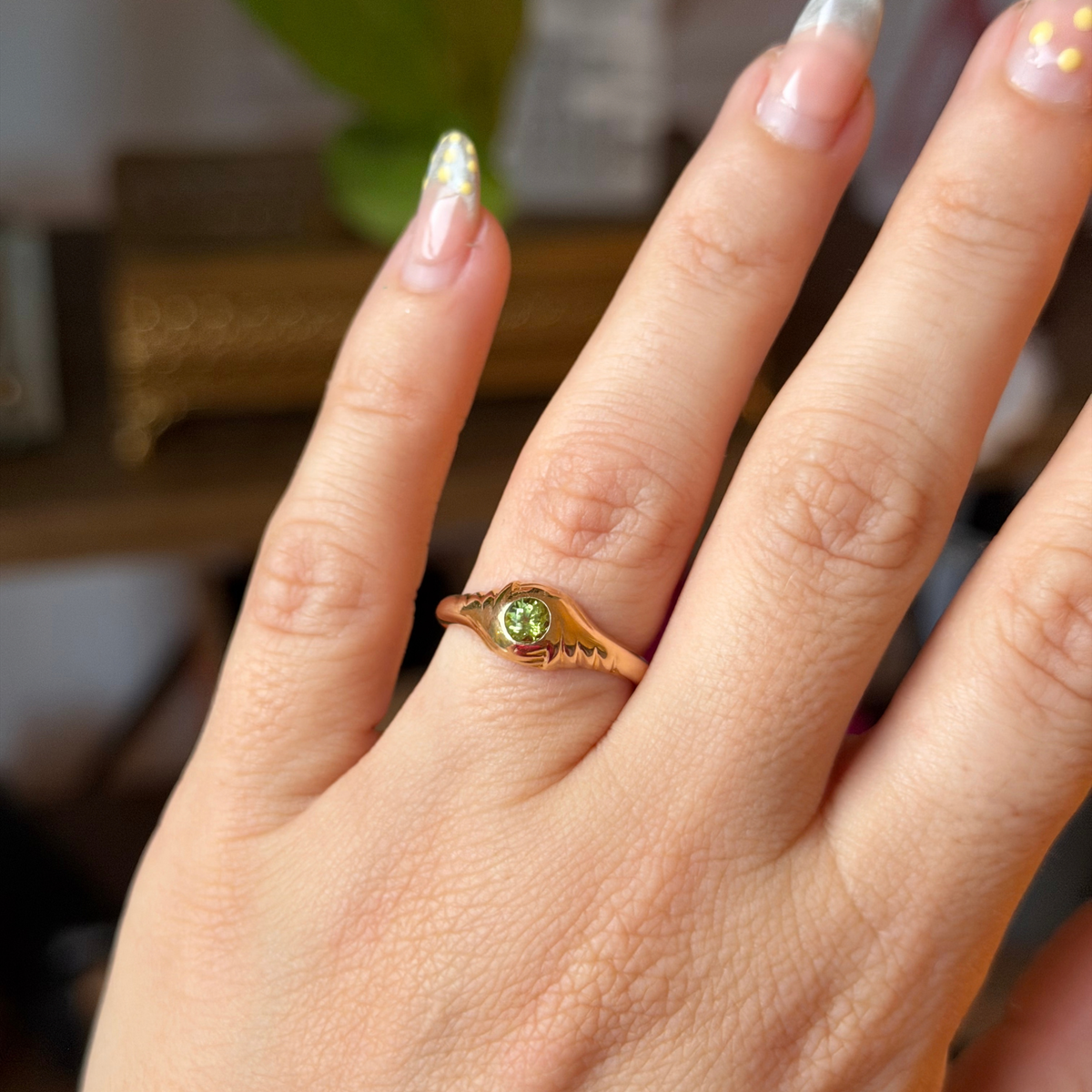14k eye of the storm ring with peridot