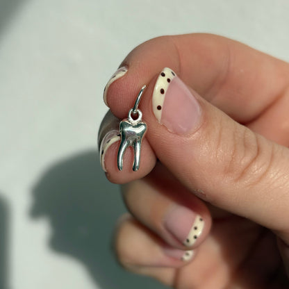 silver baby tooth charm