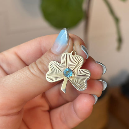 14k engine turned 3 leaf clover with blue topaz charm