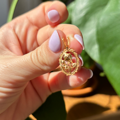 14k smaller rose in an oval frame charm