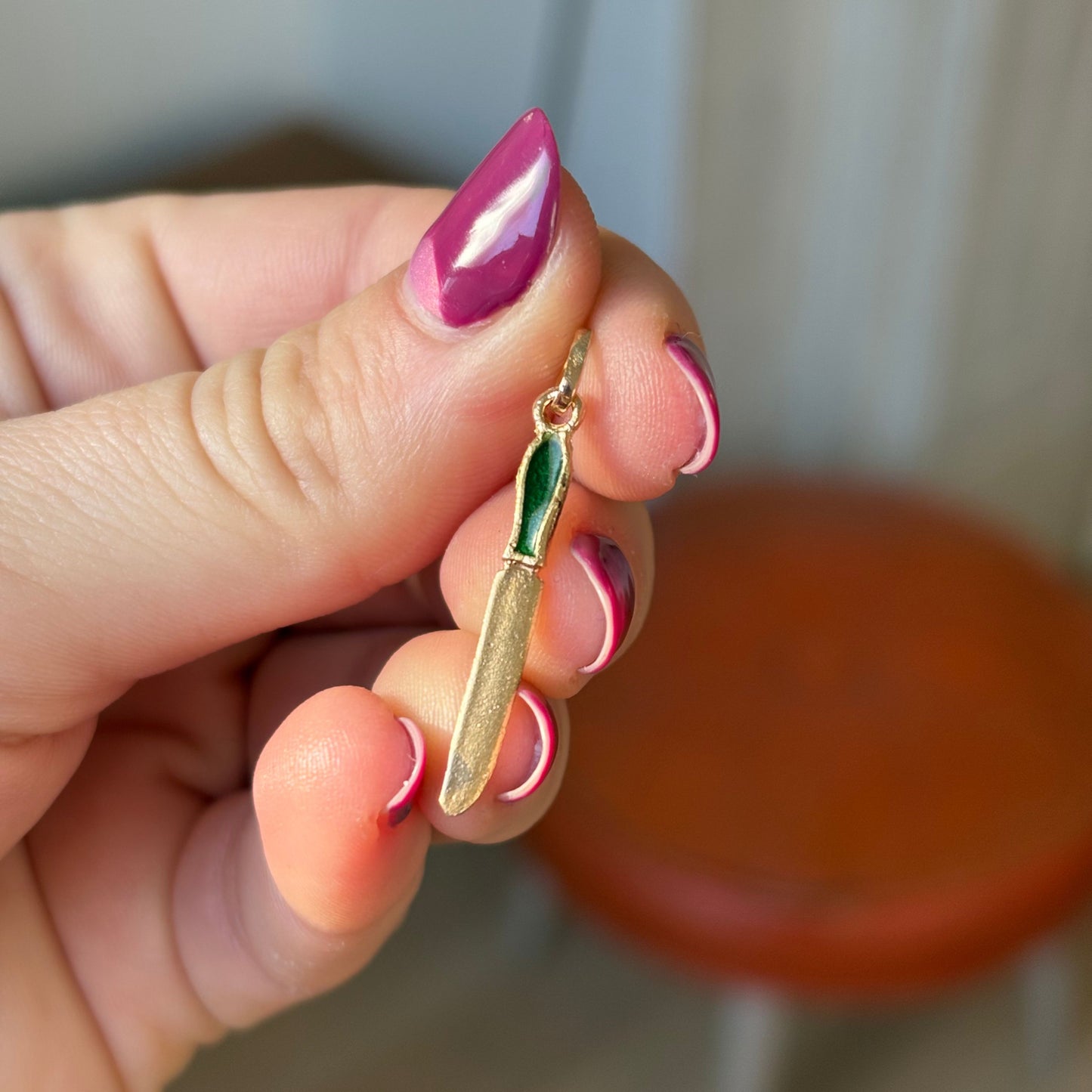 18k knife charm with green enamel handle
