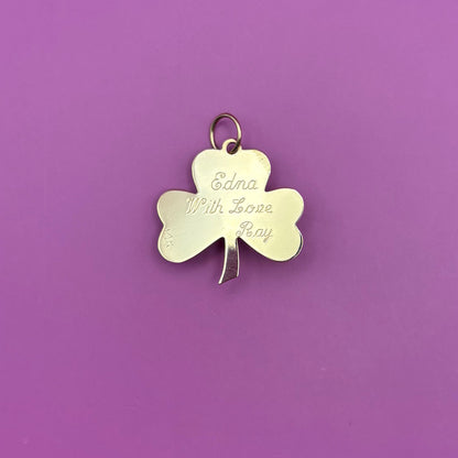 14k engine turned 3 leaf clover with blue topaz charm