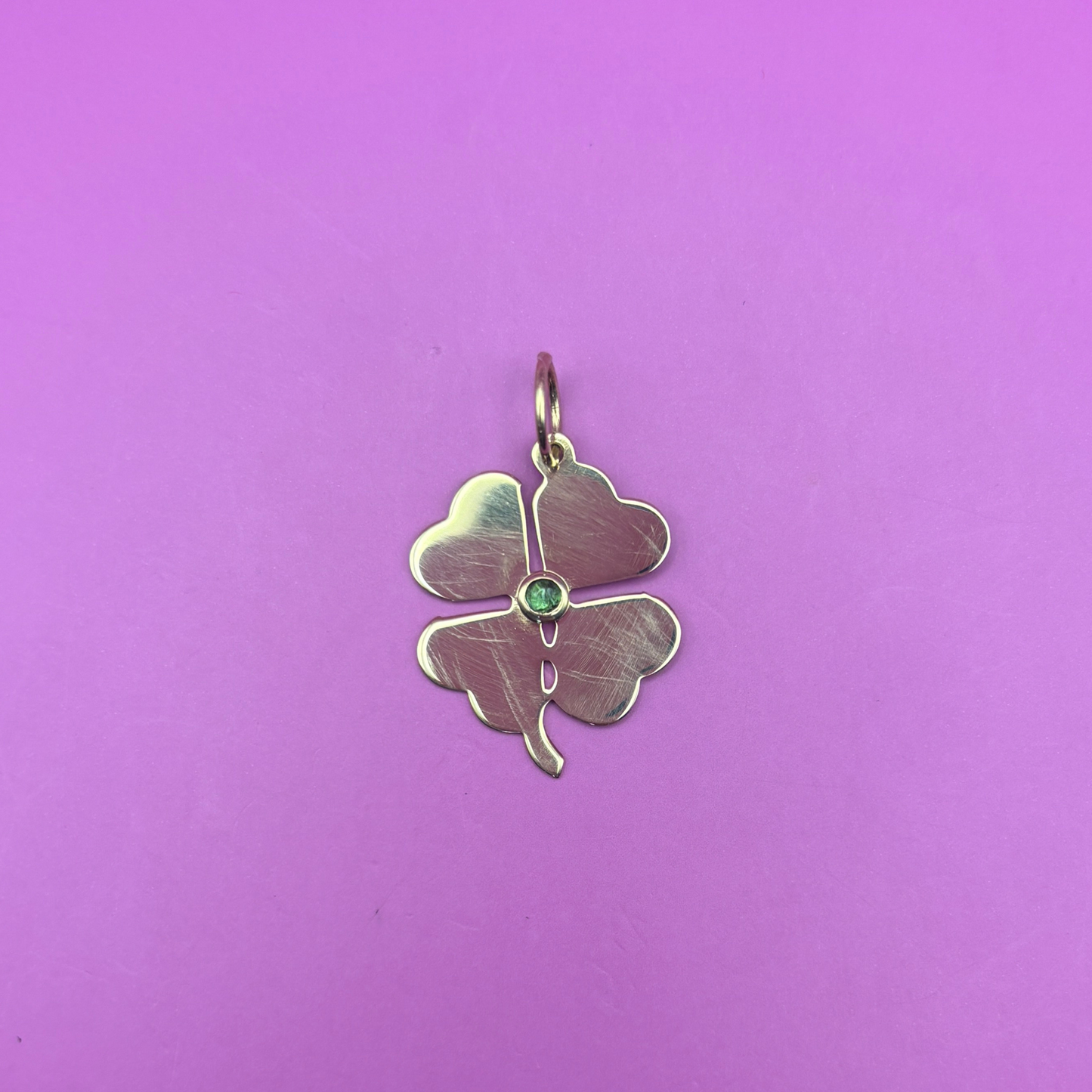 14k four leaf clover charm with bezel set green tourmaline cabochon