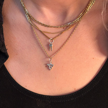 silver baby tooth with star set black diamond charm