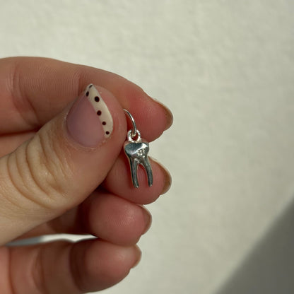 silver baby tooth charm
