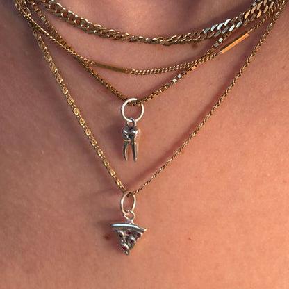 silver baby tooth with star set black diamond charm