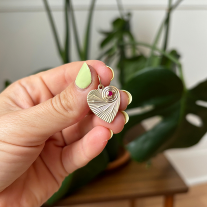 14k engine turned heart with ruby in a circle spiral charm