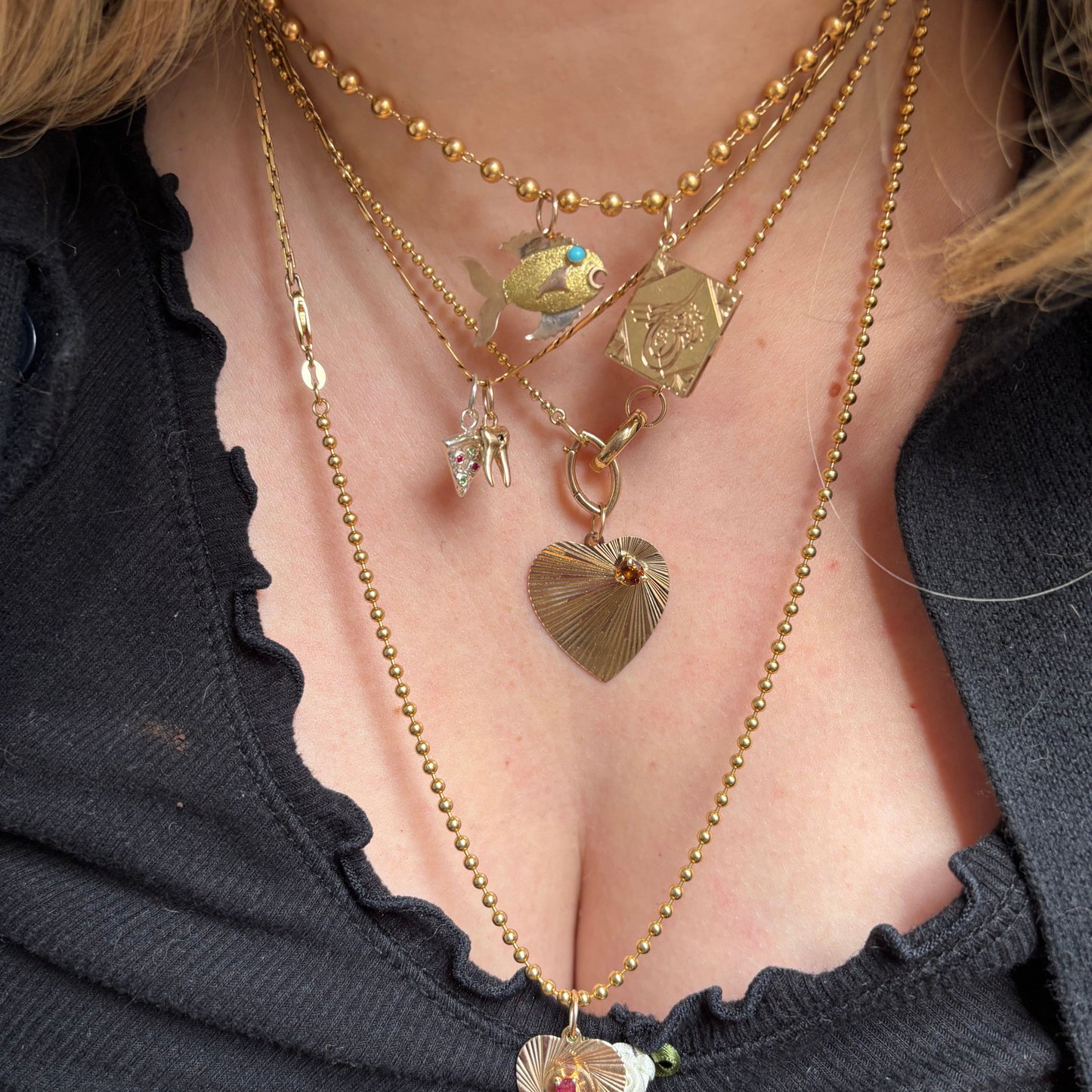 14k engine turned heart with yellow spinel charm