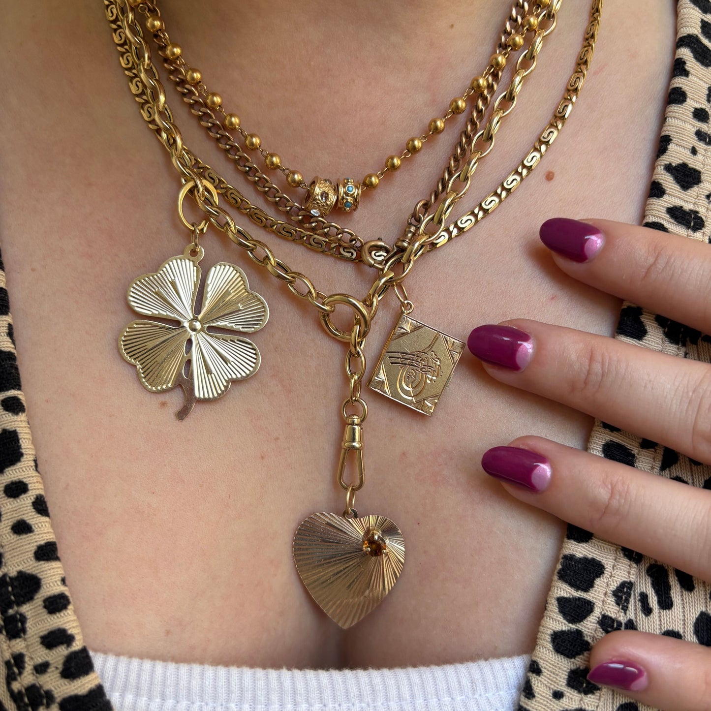 14k engine turned heart with yellow spinel charm