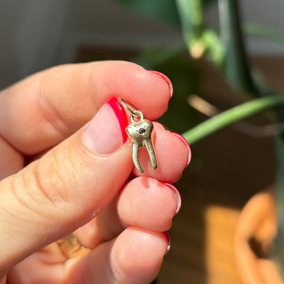 baby tooth with star set black diamond charm