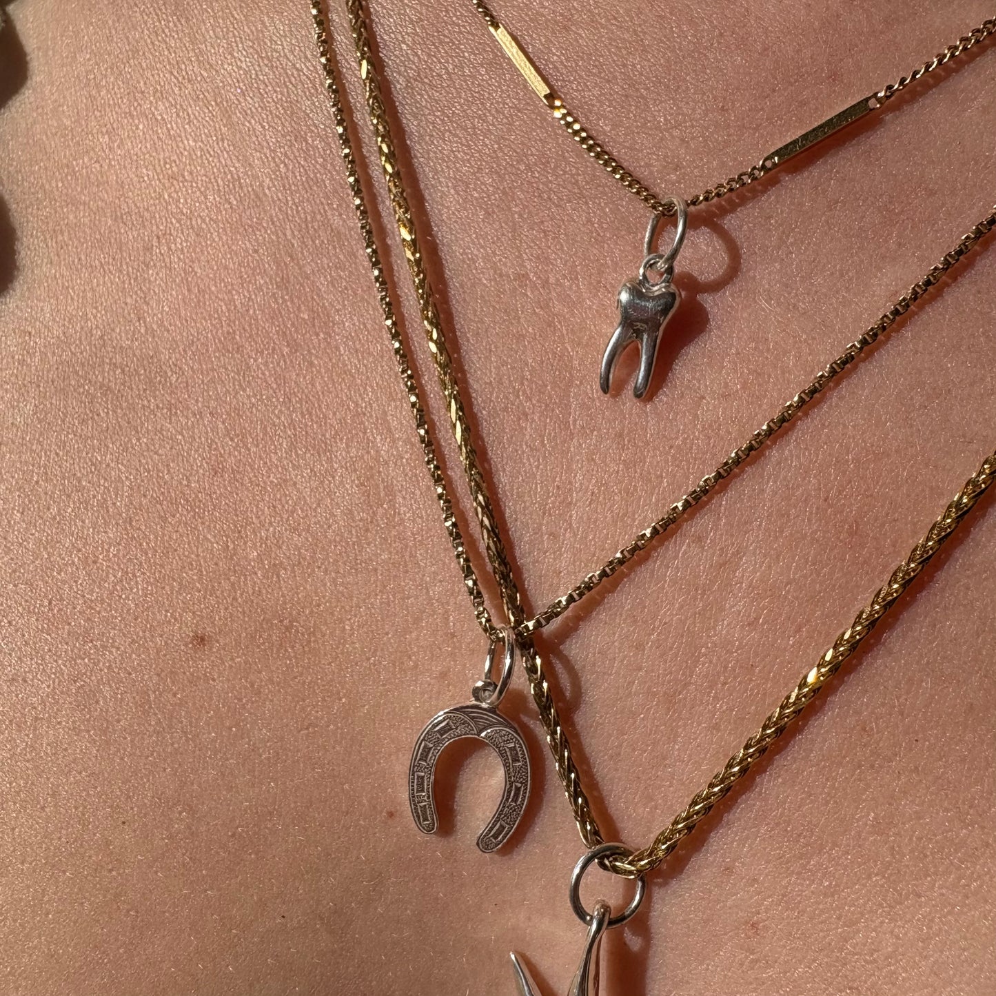 silver baby tooth charm