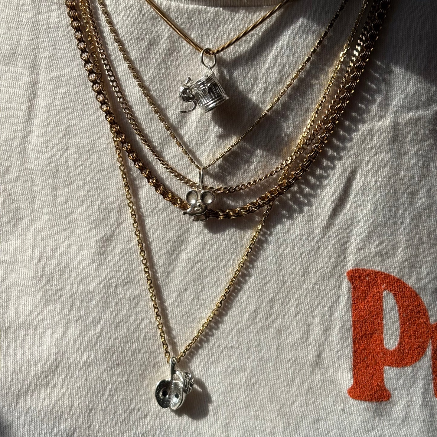 silver big apple with black diamond seeds charm