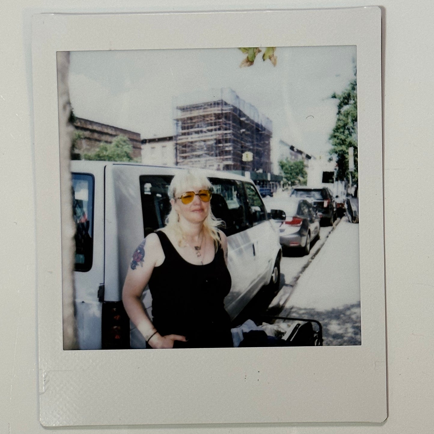 14k engine turned 3 leaf clover with blue topaz charm