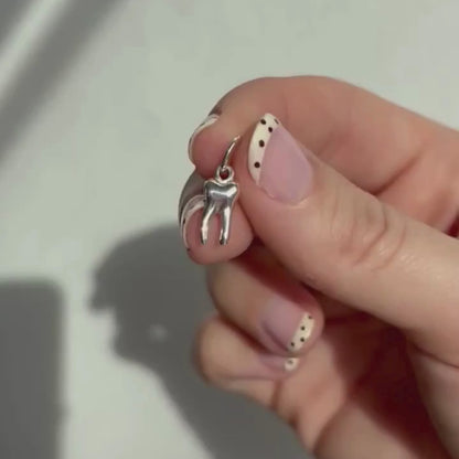 silver baby tooth charm