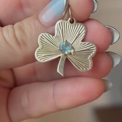 14k engine turned 3 leaf clover with blue topaz charm