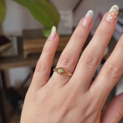14k eye of the storm ring with peridot